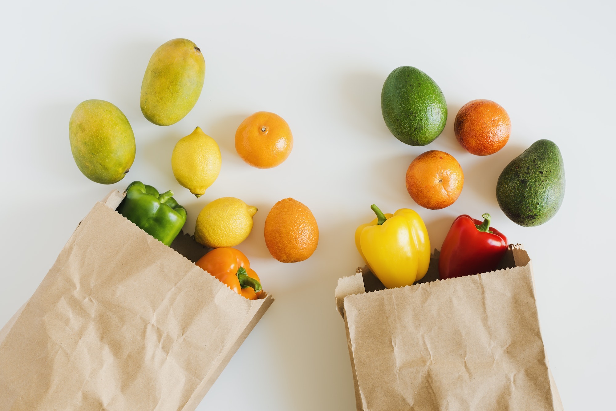 Fruits and veggies in brown recycable paper bags